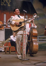 Webb Pierce on stage at the Grand Ole Opry in Nashville, Tennessee.